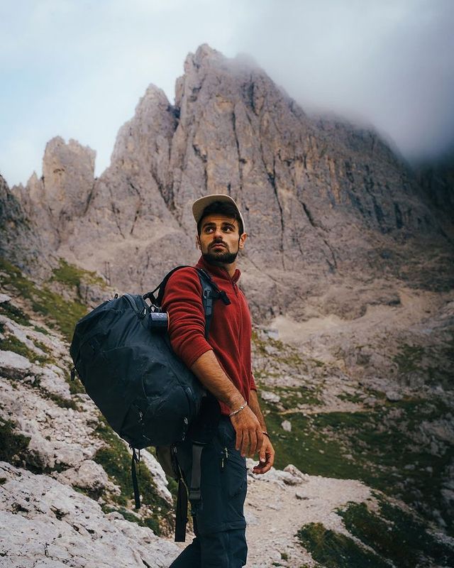 A man hiking with a secure travel backpack from Boundary Supply