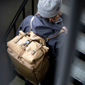A going up a set of stairs with his Errant Duffle.