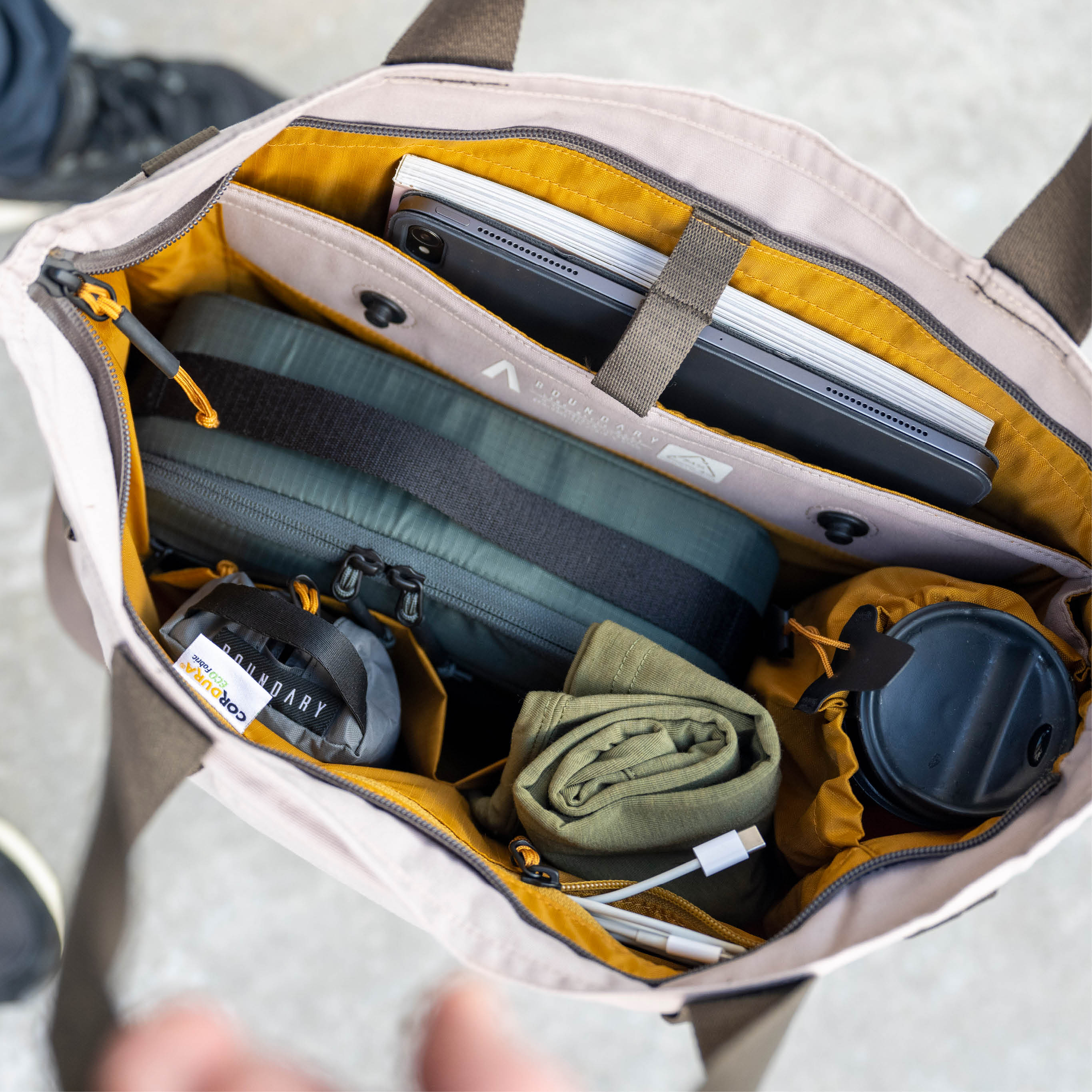 A top view of an open water resistant laptop backpack 