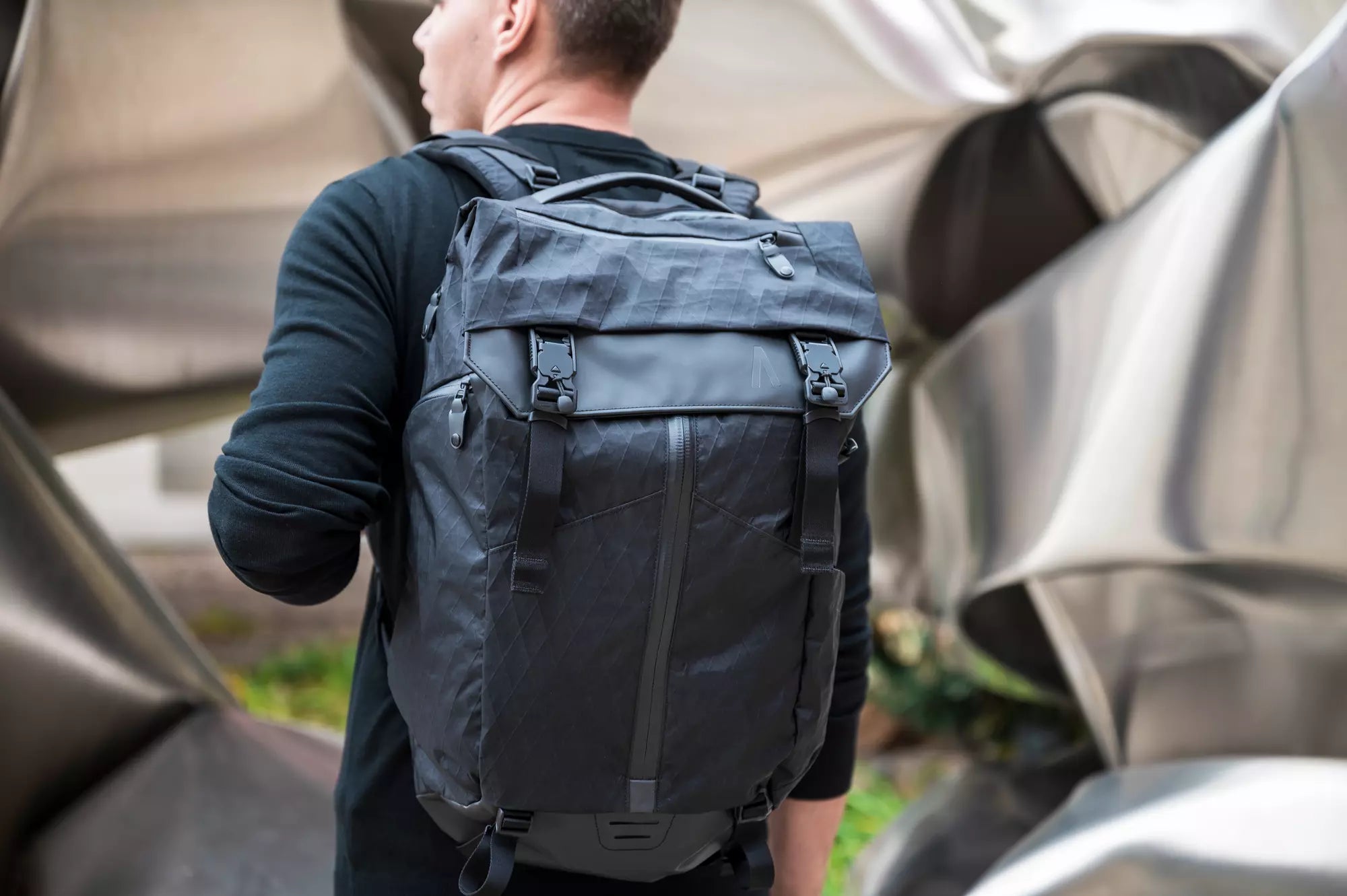 A man with his water resistant backpack from Boundary Supply