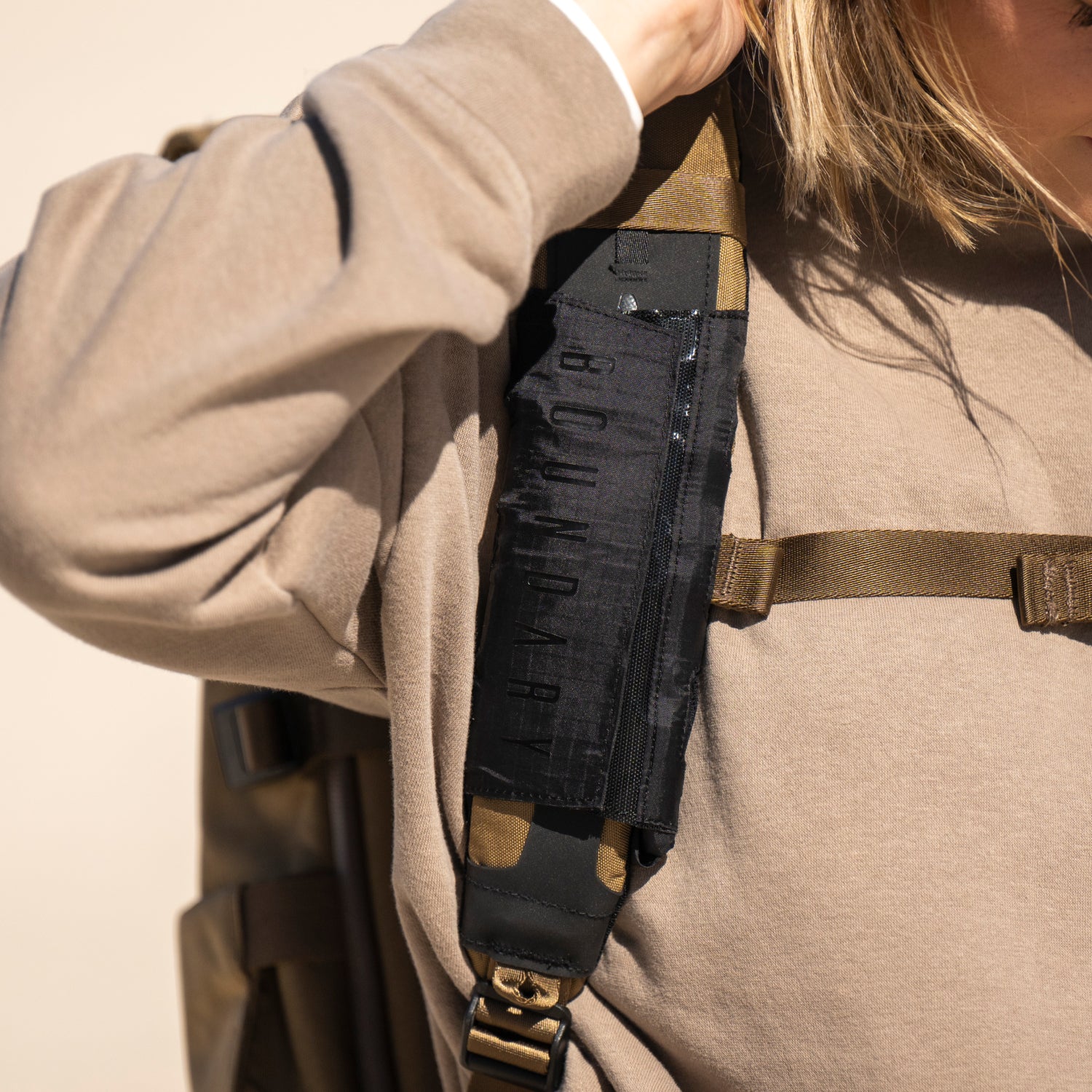 An external bottle pocket that can connect to any shoulder strap ...