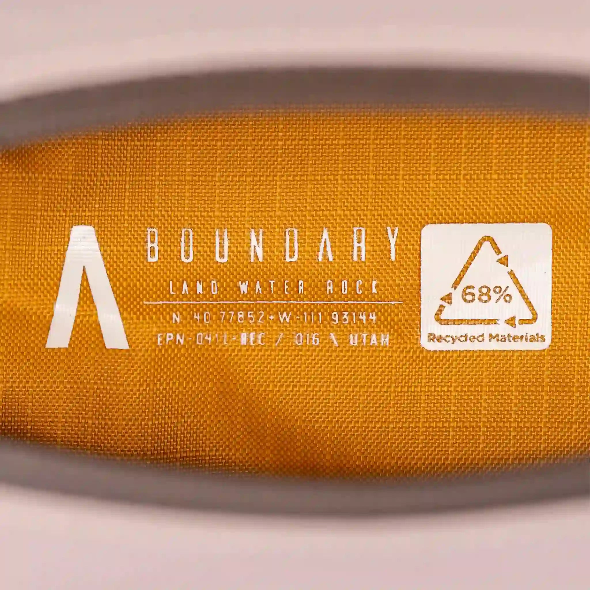 Yellow-gold interior of a Rennen EDC Case made of recycled materials.